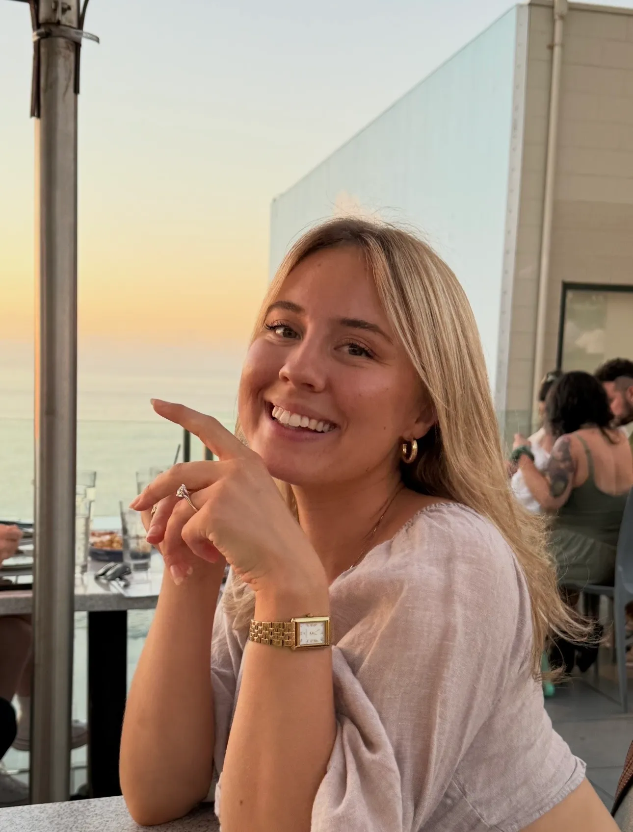 Charlotte at golden hour, ocean behind her